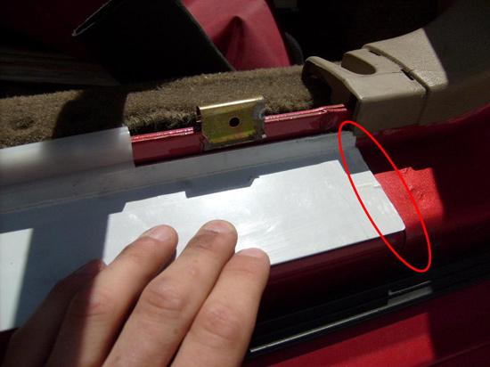 12. Once the tape is removed, place the door sill on the car.