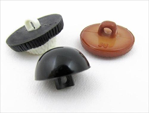 Shank style buttons are often more decorative than flat buttons because the entire top surface is available for embellishment.