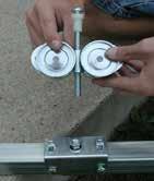 Repeat the steps to assemble and attach the remaining roller assembly to the door frame.