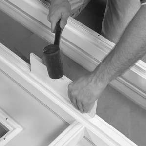 If necessary, use a wood block and rubber mallet to tap mull strip tightly into place (FIGURE 5).