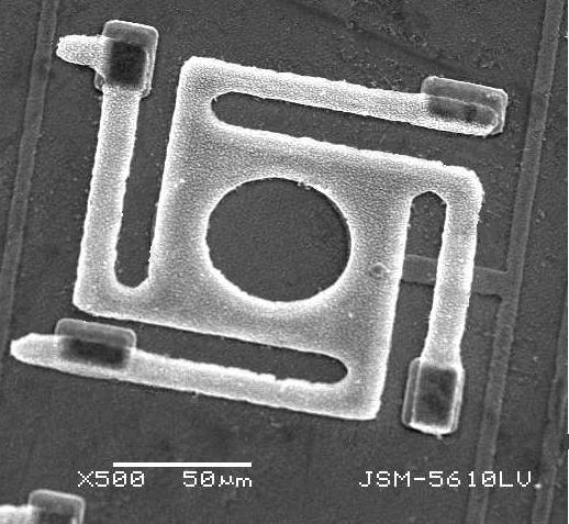 Cross-section SEM photograph of fabricated micro-bridge. Figure 8. SEM photograph of fabricated micro-bridge. Two main aspects of the optical performance would be characterized after the two DBR mirrors are added: static response and dynamic response.