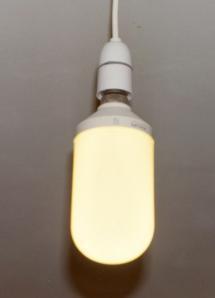 The first type of CFL commercially available - the Phillips SL In the first generation of CFLs, the ballast was a large coil. This, together with a bulky tube, resulted in a large, heavy lamp.