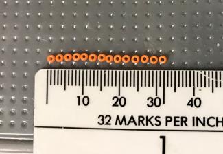 Seed bead sizes are referred to by aught. This can be shown as #11; 11/0; 11 ; or simply 11. This measurement tells you approximately how many beads are in an inch when they are laid out in a row.