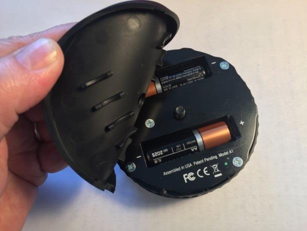Status LED Batteries Peel back the rubber Battery Cover