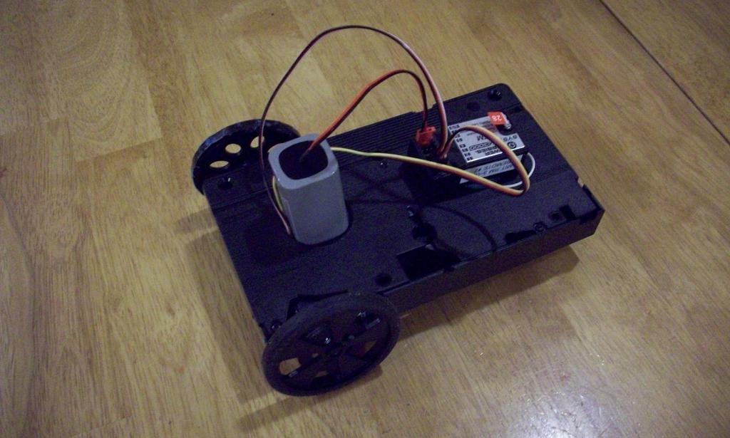 Fabrication of a Simple Car Battery (4.8V) Hobby radio receiver VHS Tape Continuous rotation servomotors Castering ski (underneath) Wheel In the course 2.