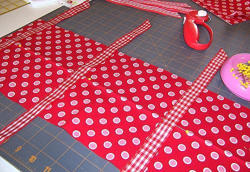 Collect eight ribbon lengths. Fold each length in half to find its center point. Place the center line of the ribbon on the center crease line of the accent strip.