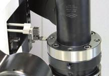 Determine radial run-out error on the KS flange adapter by placing the measuring sensor against the surface for checking the radial run-out and rotating the tool.