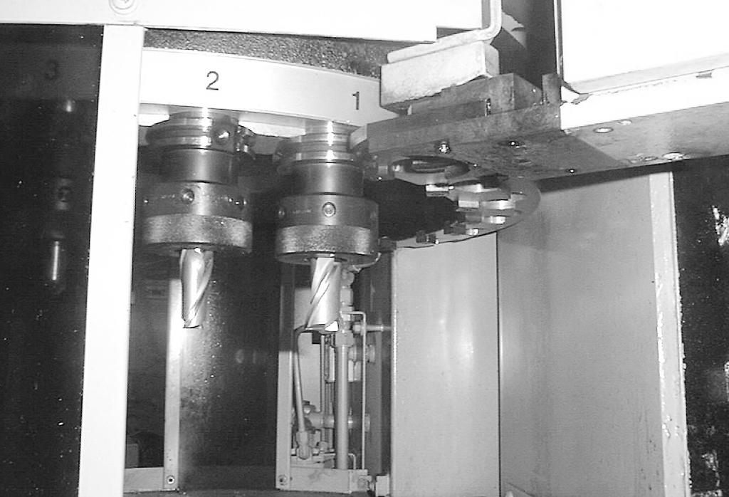 FIGURE 44 Many machine cutters have toolholders loaded in a magazine to allow a tooling change con trolled by a computer. Tool changes can take place in seconds without operator intervention.