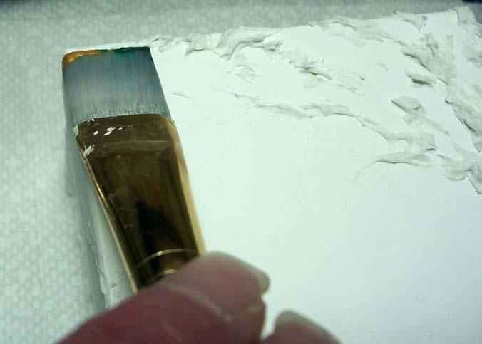 Pickup some gold paint on ONE edge of the paint brush. Pick up some green on the other edge of the paintbrush.