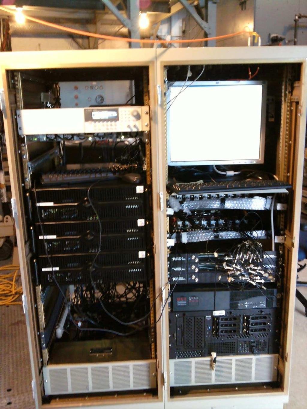 Figure 4.4: The data acquisition rack with acquisition computers and a hub, along with the old data acquisition computer and IF trays.