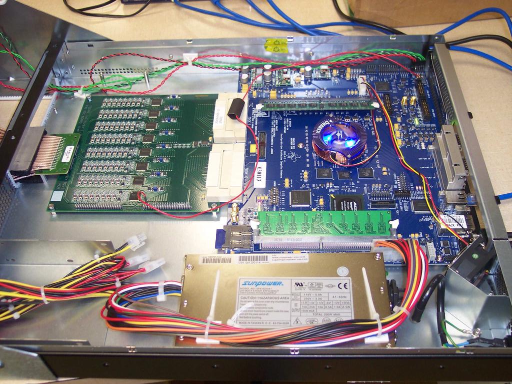 Figure 5.1: A close up view of ROACH board and x64 ADC card. boards, a server computer for data storage and compiling the designs and a host computer for the boards. 5.2.1 Virtex-5.