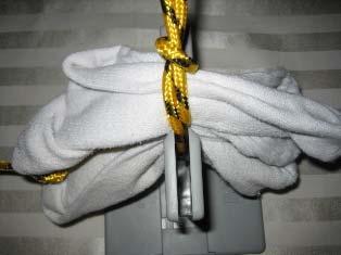 9. While the socks and nylon rope are still in the Bowdabra, thread the two loose ends of