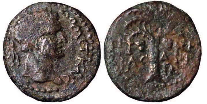It seems to have the head of Apollo on the obverse and a standing figure, perhaps Nike (Victory) on the reverse. It is probably a Seleucid coin.