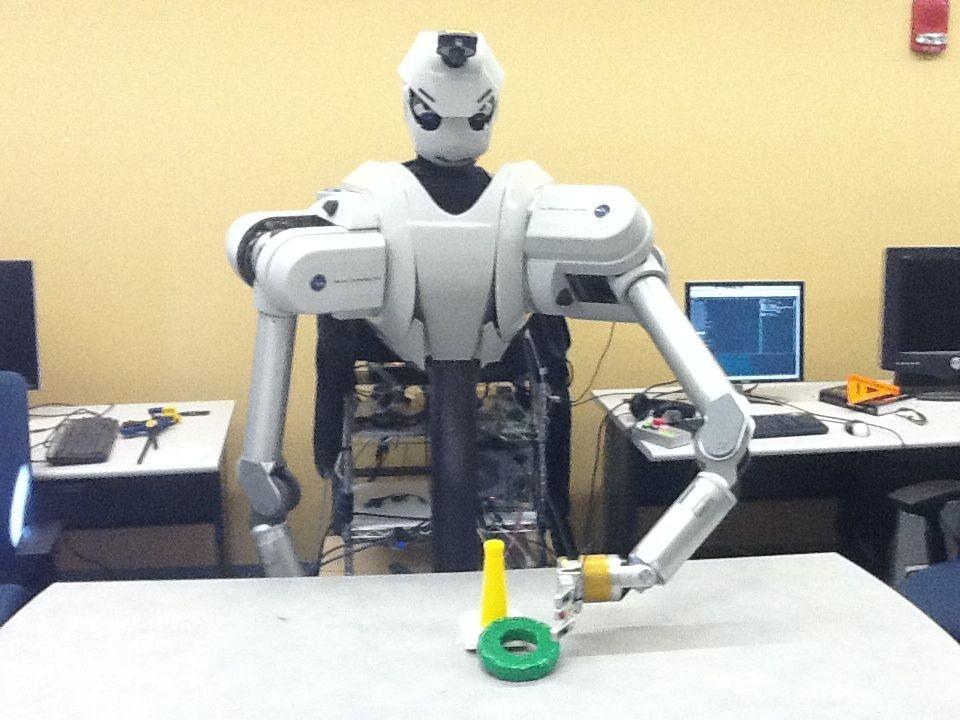 Experimental Setup: The experimental setup (pictured in Figure 2) consisted of the following: The robot, which is an upper-torso humanoid robot.