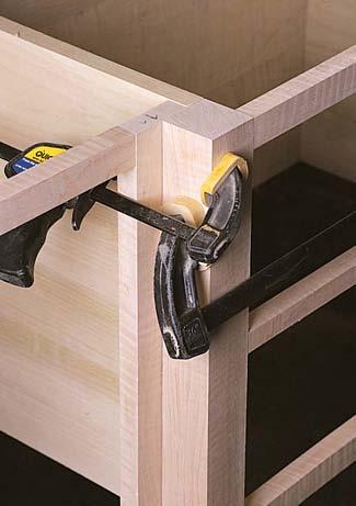 When the door section bottoms are installed they must be notched to fit around the legs.they re attached using 3 4" x 3 4" cleats attached to the partition and end.