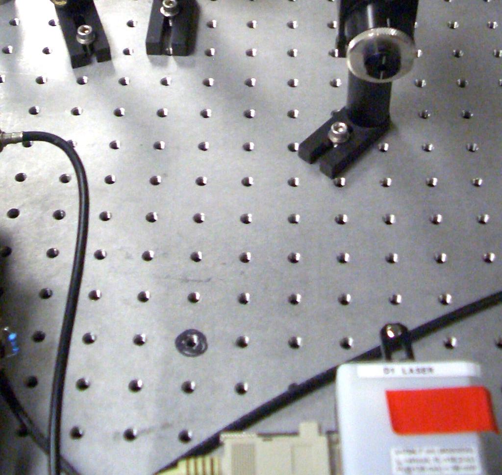 The laser then passed through the optical isolator, reflected off the slide and was sent to the beam splitter.