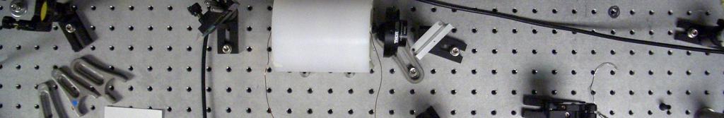 A quarter-wave plate, which makes the laser light circularly polarized, was placed after the beam splitter and acted to attenuate the probe beams.