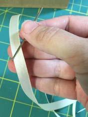 created in the bag. Photo 15 18. Thread your ribbon into your tapestry needle. Photo 16 19.