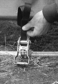 Move to one side ratchet attached to a rafter and cut a slit in the conduit pocket above the conduit and in line with the ratchet. 3.