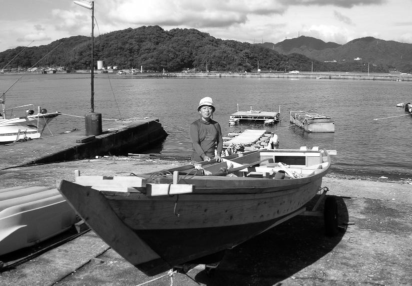 Tosa Wasen: A Traditional Japanese Twenty-Foot Fishing Boat..... by Clare Hess Figure 1. Mr. Shibafuji standing next to a Tosa wasen at Kansu-hori Harbor, Urado Bay, Kochi City in 2008.