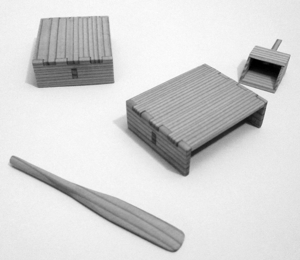 Figure 12. A small variety of included accessories added some life to the model. The larger structures are simple, low wooden seats. What looks like a dustpan is a bailer.