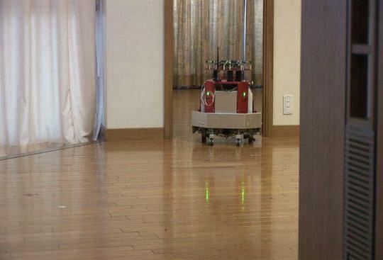 When the robot receives the command, it plans the path from the bedroom to the kitchen and starts moving(a,b).