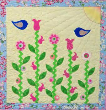Trace the applique pieces onto the paper side of the Wonder-Under. Group like colors together. Fuse the Wonder-Under to the wrong side of the applique fabrics.