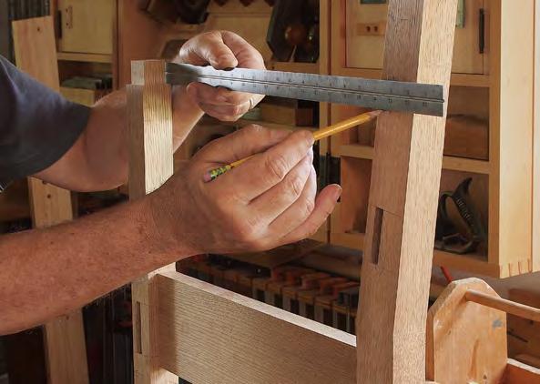 Add the armrests With double tenons at the back and a through-mortise and tenon at the front, the armrests add extra insurance against racking. Dry-fit to locate the notch in the rear leg.