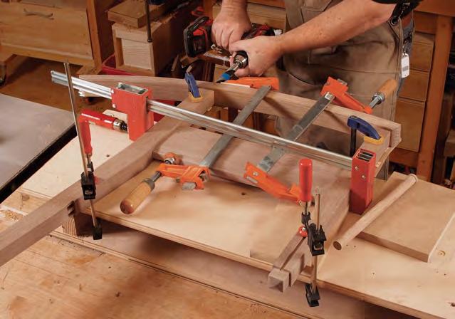 Caul positions the rocker to drill holes in line with the legs. Pre-drill the rockers.