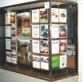 suspending cabinets or merchandising cubes of timber + glass.