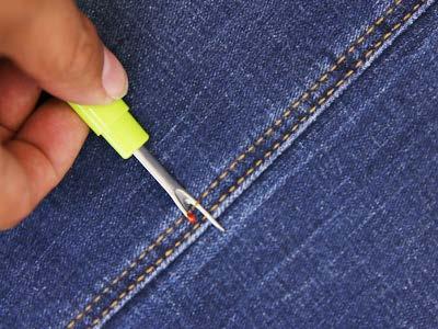 Open the opposite seam (the inseam) from where you will be embroidering (the outseam).