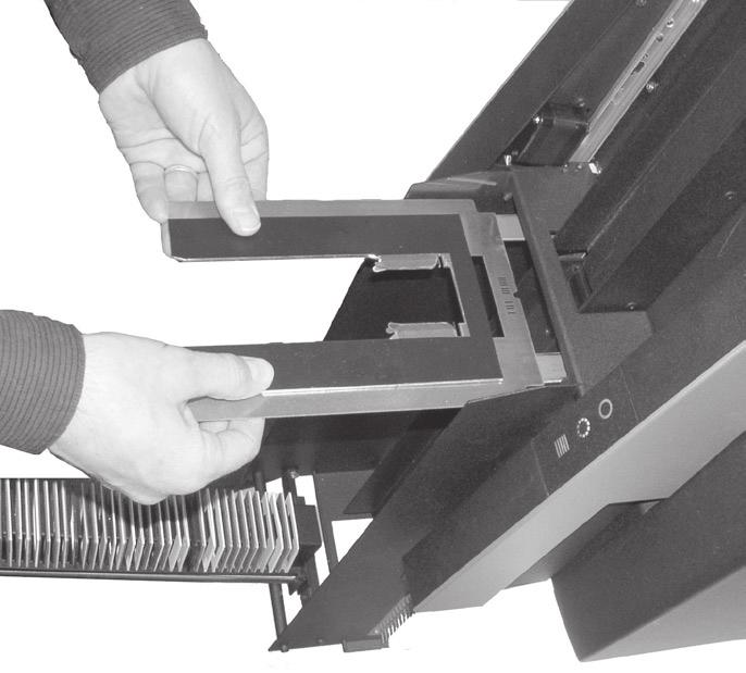 Figure 6: Inserting the Slide original holder. 16. Position the Slide holder on the two supports extending from the front of the Slide Feeder and slide the holder into the scanner.