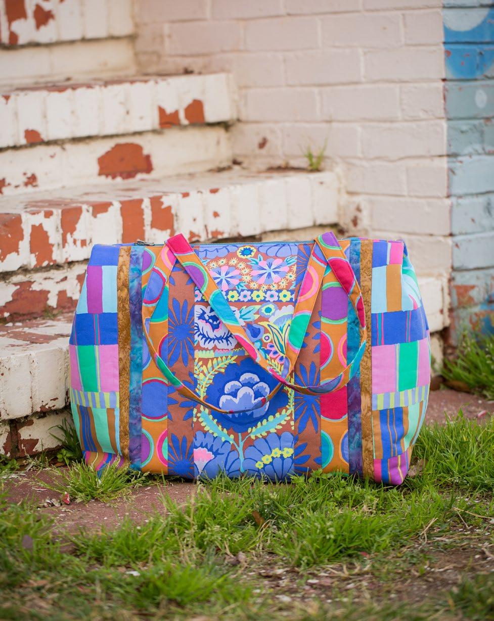 Featuring Artisan by Kaffe Fassett Whether you re going to the mall or on an overnight trip, this quilted bag is ideal to hold all your necessities. It also makes a great gift, as one size fits all!