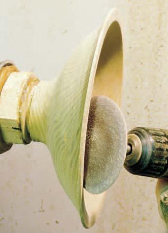 revolving piece on the lathe reduces swirl lines. Grits 80 and/or 100 are hard and aggressive.