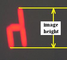 7.7. Procedure Figure 7.9: A picture of what your image should look like on the screen, notice that it is inverted (i.e. real), showing how to measure the image height. 3.