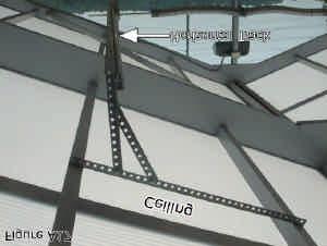Cover weight with omega tube provided or PVC tube (if ordered). Example: Figure A16 Step 1 Step 2 Secure horizontal track using punched angle.