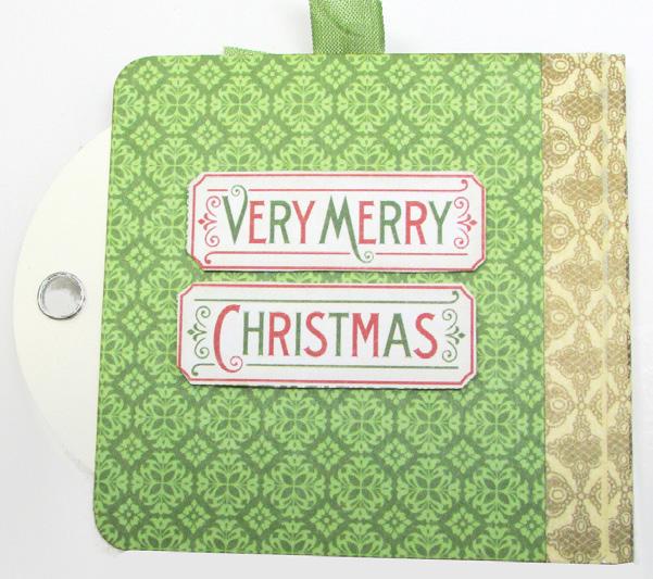 Add the Holiday Time sentiment and the postage stamp image to the tag front with foam dimensional adhesive.