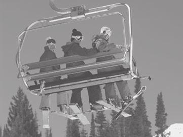 ELABORATE B A chairlift descends from a mountain top to pick up skiers at the bottom.