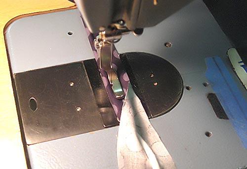 Using a straight stitch, sew all of your 1½" piping strips together end-to-end to create one long strip. 2. Center the ¼" piping cord on the long fabric strip.