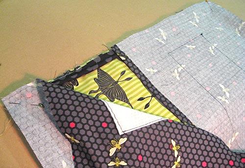 Be careful with your pinning; you need to make sure the overlapping bottom pieces don't shift when you sew. 2.