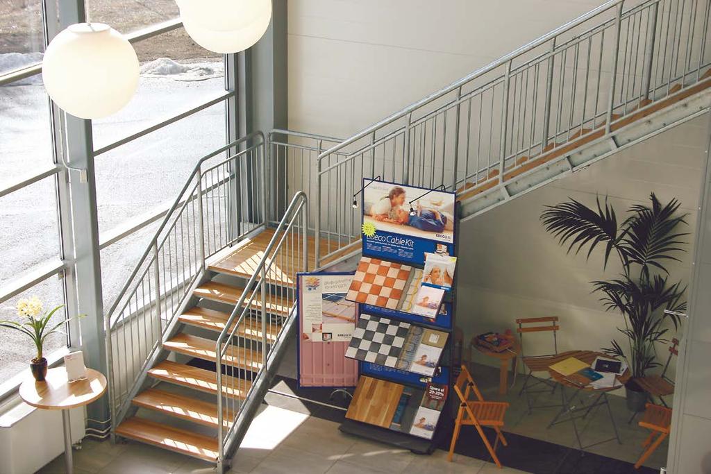 Straight staircases for office and home applications Painted staircase with crenelated mesh.