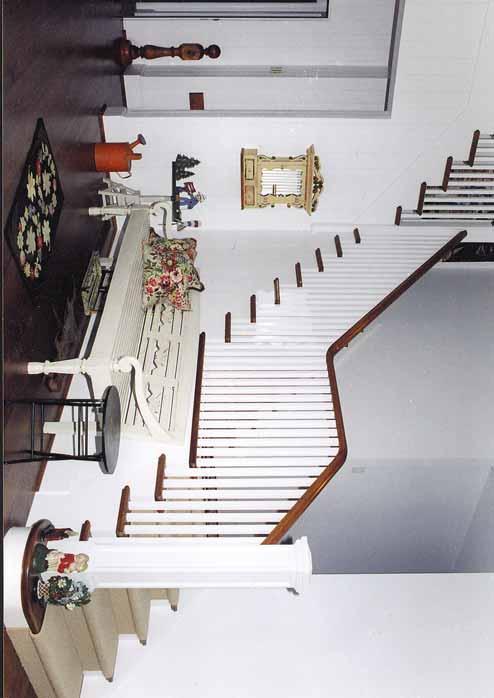 Straight Staircase 1 1/2" Roman ogee tread profile in maple Simple 1 1/4" square pickets tightly spaced together with 3