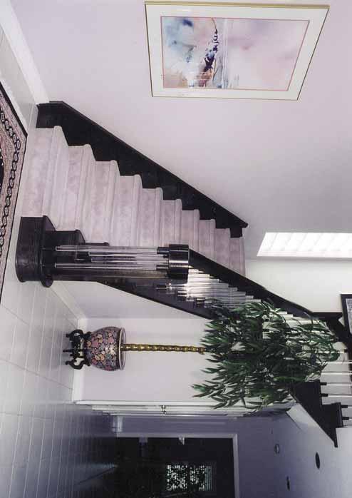 Ultra Modern Staircase Standard stair with 1 1/8" treads and stringers Continuous 5 1/2" x 1 3/4" railing cap with