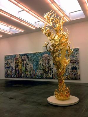 (foreground) Takashi Murakami, "Flame of Desire - Gold," 2013, gold leaf on fiberglass (background) Takashi Murakami, "69 Arhats beneath the Bodhi Tree," 2013 acrylic, gold and