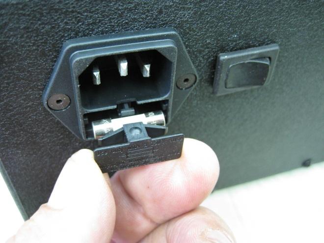 The fuse is located in the bottom portion of the power entry on the back of the controller. Use a small screwdriver to pull open the fuse compartment. The fuse is 5mm size and rated 15 amps.