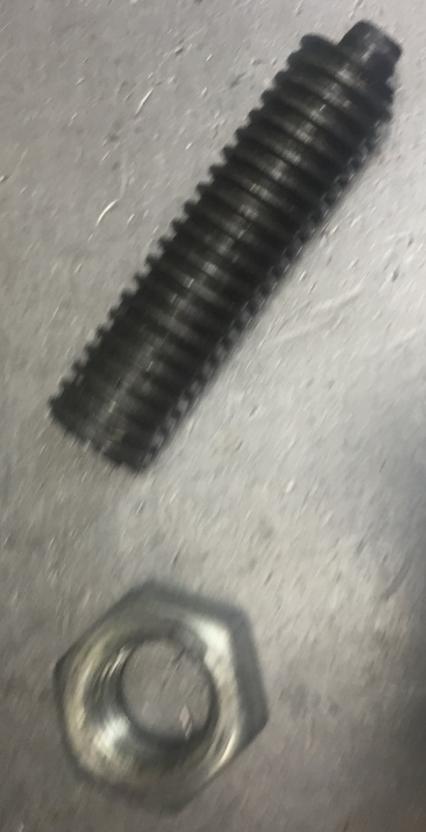 The nub on the end of the threaded rod engages a small block.