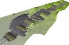 Free span mitigation supports (in green) including counterfills (in grey) for geotechnical stability. rock.