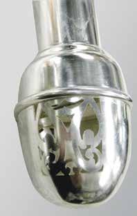Not only is this a highly decorative component of the design but it is also a lighter weight option for the large head than a solid silver one would be (plates 5 9).