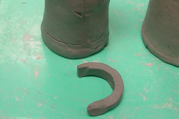 create the curved top of the jug. e.