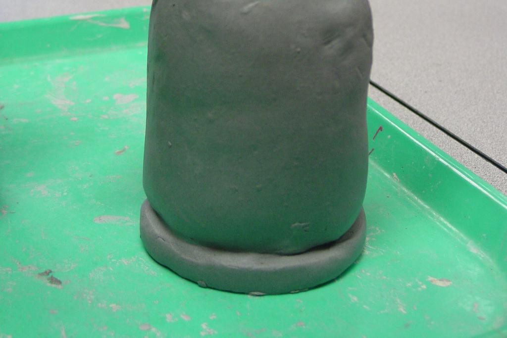 Teacher will demonstrate how to make a basic nose form from a chunk of clay that was a scrap or reclaimed clay from the pug mill. See samples below.